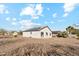 Spacious backyard view featuring a desert landscape and solar panels on the home's roof at 12459 W Benito Dr, Arizona City, AZ 85123