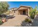 Paver patio backyard featuring a small decorative fountain and desert landscaping at 12541 W Miner Trl, Peoria, AZ 85383