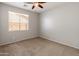 Bedroom featuring a ceiling fan and a window with views of the outdoors at 12541 W Miner Trl, Peoria, AZ 85383