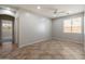 Well-lit bedroom featuring tile flooring and a ceiling fan at 12541 W Miner Trl, Peoria, AZ 85383