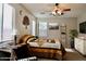 Comfortable bedroom featuring a ceiling fan, natural light, and calming decor at 12541 W Miner Trl, Peoria, AZ 85383