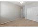 Carpeted bedroom with a ceiling fan and closet with sliding doors at 12541 W Miner Trl, Peoria, AZ 85383