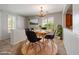 Bright dining room features a round table, chandelier, and neutral colors at 12541 W Miner Trl, Peoria, AZ 85383