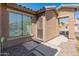 Side entryway featuring a security door and decorative stone pathway at 12541 W Miner Trl, Peoria, AZ 85383