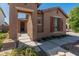 Charming front entrance with a covered walkway and desert landscaping at 12541 W Miner Trl, Peoria, AZ 85383