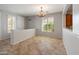 Bright living room with tile flooring, neutral paint, and views of the front yard at 12541 W Miner Trl, Peoria, AZ 85383
