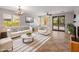 Cozy living room with lots of natural light, tile floors, and modern furnishings at 12541 W Miner Trl, Peoria, AZ 85383