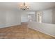 Spacious living room featuring tile floors and access to other areas of the home at 12541 W Miner Trl, Peoria, AZ 85383