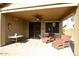 Covered patio seating area is a perfect spot for relaxing or entertaining at 12541 W Miner Trl, Peoria, AZ 85383
