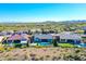 A stunning aerial view of a residential community featuring well-maintained homes, serene landscapes, and mountain views at 12576 W Oyer Ln, Peoria, AZ 85383