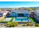 Aerial of a backyard offering a refreshing pool, ample patio space, and mountain views for outdoor enjoyment at 12576 W Oyer Ln, Peoria, AZ 85383