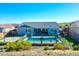 Aerial backyard view featuring a private pool, a play structure, and artificial turf at 12576 W Oyer Ln, Peoria, AZ 85383