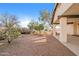 Landscaped backyard with gravel, desert plants, and covered patio at 14237 N Westminster Pl, Fountain Hills, AZ 85268
