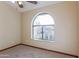 Bedroom with arched window and ceiling fan at 14237 N Westminster Pl, Fountain Hills, AZ 85268