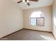 Bedroom with arched window and ceiling fan at 14237 N Westminster Pl, Fountain Hills, AZ 85268