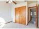Bedroom with double doors and access to another room at 14237 N Westminster Pl, Fountain Hills, AZ 85268