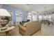 Living room showcasing a large tan couch and built-in shelving at 15111 W Whitewood Dr, Sun City West, AZ 85375