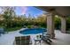 Serene pool area with lounge chairs and stone patio at 15250 S 20Th Pl, Phoenix, AZ 85048