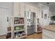 Spacious kitchen storage featuring pull out shelves and stainless steel appliances at 1626 E Kathleen Rd, Phoenix, AZ 85022