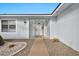 Front entrance of the house with a security gate and walkway at 16828 N 107Th Dr, Sun City, AZ 85351