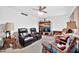 Living room with a TV, and comfortable leather recliners at 16828 N 107Th Dr, Sun City, AZ 85351