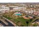 Aerial view showing community pool, playground, and neighborhood homes at 18402 N 65Th Pl, Phoenix, AZ 85054