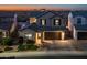 Two-story house with a landscaped yard at dusk at 18402 N 65Th Pl, Phoenix, AZ 85054