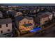 Night view of home with pool in a community at 18402 N 65Th Pl, Phoenix, AZ 85054