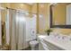 Bathroom with shower/tub combo and yellow walls at 18402 N 65Th Pl, Phoenix, AZ 85054