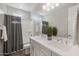Bathroom with double vanity and grey accents at 18402 N 65Th Pl, Phoenix, AZ 85054