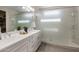 Bathroom with white cabinets and a large walk-in shower at 18402 N 65Th Pl, Phoenix, AZ 85054