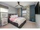 Bright bedroom with a comfortable bed and accent wall at 18402 N 65Th Pl, Phoenix, AZ 85054