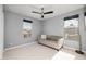 Bedroom with sofa and ceiling fan at 18402 N 65Th Pl, Phoenix, AZ 85054