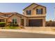 Two-story home with landscaping and a brown garage door at 18402 N 65Th Pl, Phoenix, AZ 85054