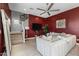 Gathering room features a cozy sectional sofa and a large TV, perfect for relaxation at 18402 N 65Th Pl, Phoenix, AZ 85054