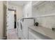 Laundry room with built-in cabinets and closet at 18402 N 65Th Pl, Phoenix, AZ 85054
