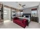 Main bedroom with a brick accent wall and a large bed at 18402 N 65Th Pl, Phoenix, AZ 85054