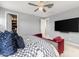 Spacious main bedroom with large bed, walk-in closet, and TV at 18402 N 65Th Pl, Phoenix, AZ 85054