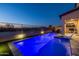 Enjoy this refreshing pool with a relaxing patio area and lovely nighttime lighting at 18402 N 65Th Pl, Phoenix, AZ 85054