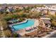 Community swimming pool with lounge chairs and shaded areas at 18402 N 65Th Pl, Phoenix, AZ 85054