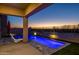 Relax and unwind by the pool in this private backyard oasis with comfortable seating at 18402 N 65Th Pl, Phoenix, AZ 85054