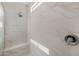 Modern shower with built-in seat and marble-look tile at 18402 N 65Th Pl, Phoenix, AZ 85054