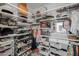 Spacious walk-in closet with ample shelving and drawers at 18402 N 65Th Pl, Phoenix, AZ 85054