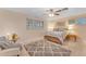 Cozy bedroom featuring neutral tones, shuttered windows, and a patterned rug at 2011 W Cambridge Ave, Phoenix, AZ 85009