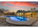 Inviting pool, perfect for cooling off on hot summer days, is surrounded by a patio for lounging at 2011 W Cambridge Ave, Phoenix, AZ 85009