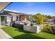 Modern backyard with a built-in spa, artificial turf, and a built-in grill at 27951 N 96Th Pl, Scottsdale, AZ 85262
