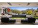 Stunning backyard patio with a fire pit, pool, and mountain views at 27951 N 96Th Pl, Scottsdale, AZ 85262