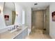 Modern bathroom with a large glass shower and marble vanity at 27951 N 96Th Pl, Scottsdale, AZ 85262