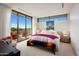 Bright bedroom with large windows and access to a balcony at 27951 N 96Th Pl, Scottsdale, AZ 85262