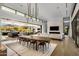 Open concept dining room with a large table and modern lighting at 27951 N 96Th Pl, Scottsdale, AZ 85262